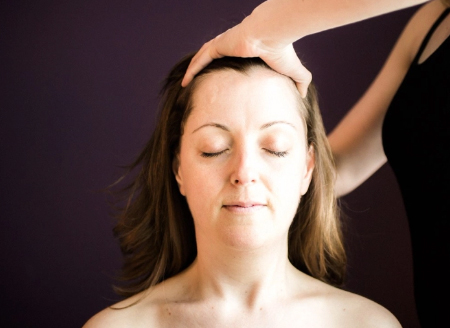Woman receiving an Indian Head Massage
